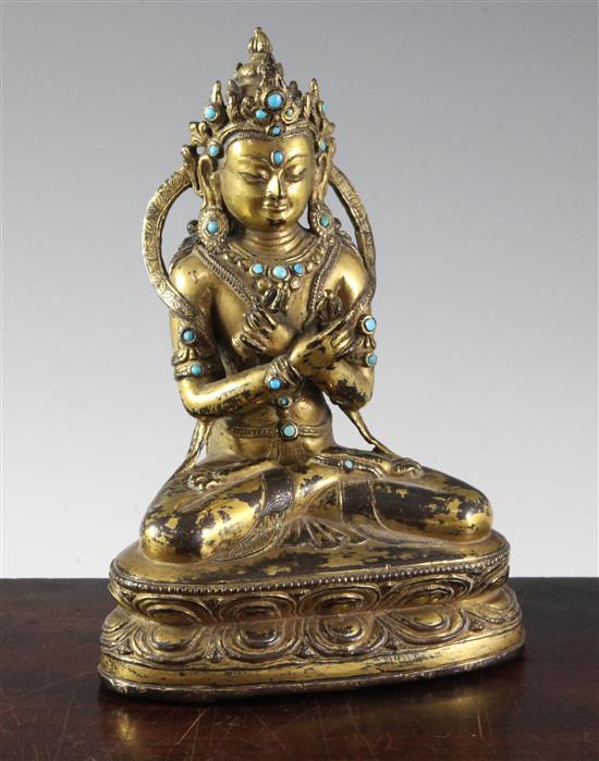 A Nepalese gilt copper alloy jewelled figure of Vajradhara, early Malla period, 15th century, height 20.3cm, later paste and stone ca